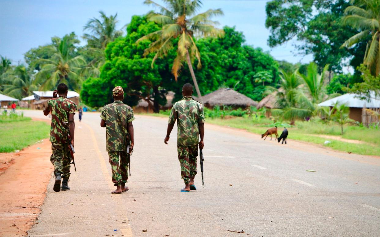 Soldiers from the Mozambican army patrol the streets in October 2019 in Mocimboa da Praia, Mozambique. Shadowy islamist militants have launched a sporadic set of attacks on the majority-Muslim province since a first offensive on the town of Mocimboa da Praia in October 2017. - ADRIEN BARBIER /AFP