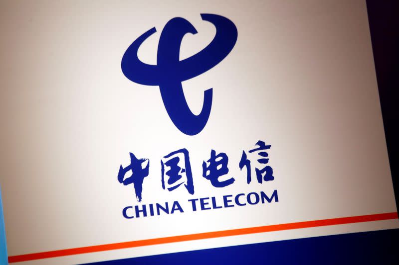 The company logo of China Telecom is displayed at a news conference in Hong Kong