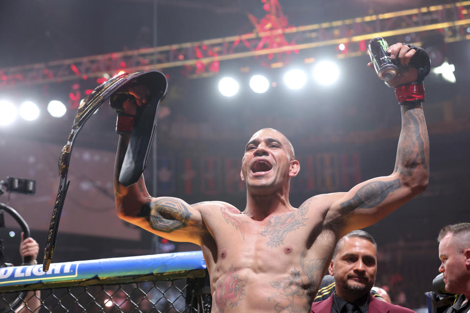 UFC light heavyweight champion Alex Pereira leaves the octagon after defeating Jamahal Hill in a title defense during the UFC 300 mixed martial arts event Saturday, April 13, 2024, in Las Vegas. (Steve Marcus/Las Vegas Sun via AP)