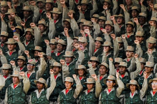 Members of the Bolivarian militias take part in the launching ceremony of the "Plan Republica", the security operation for the presidential election on May 20, in Caracas