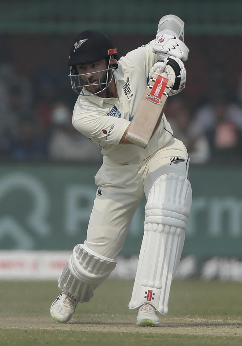 New Zealand's captain Kane Williamson plays a shot during the day three of their first test cricket match with India in Kanpur, India, Saturday, Nov. 27, 2021. (AP Photo/Altaf Qadri)