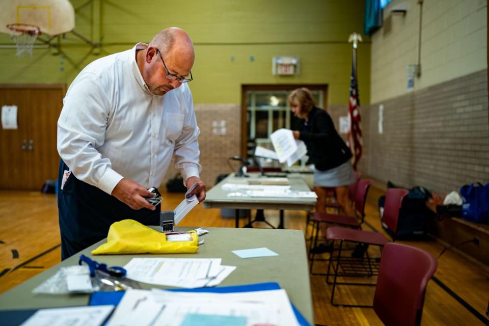 A person standing at a table