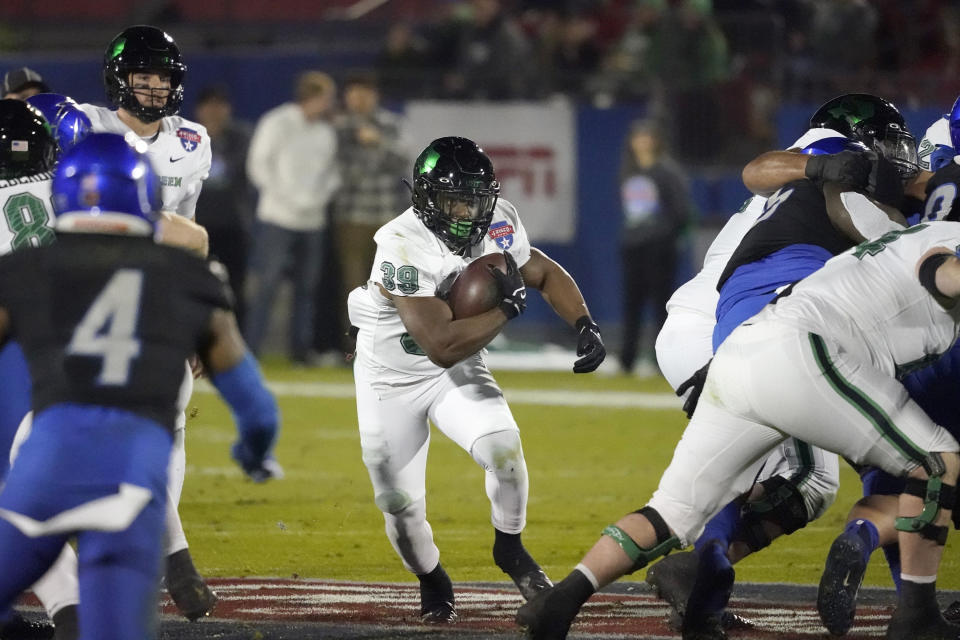North Texas linebacker Bryce Drummond (34) finds an opening to run during the first half of the Frisco Bowl NCAA college football game against Boise State Saturday, Dec. 17, 2022, in Frisco, Texas. (AP Photo/LM Otero)