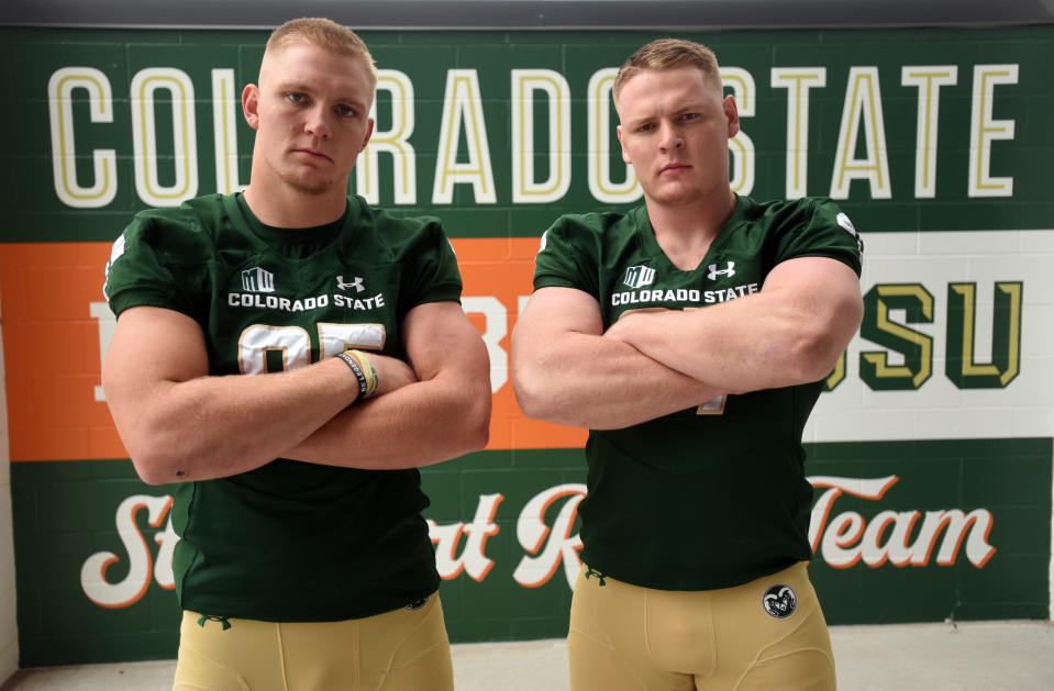 Colorado State football players Trey McBride and Toby McBride stand in Canvas Stadium in Fort Collins for a portrait in 2019.