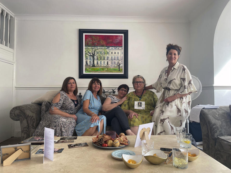 The family of Peter Lloyd, who had liver cancer, and was infected with hepatitis C after receiving transfusions of contaminated blood years before his death, pose for a photo, Friday May 17, 2024. From left: Martha Charalambous, Mary Lovell, Helene Hall, Sally Martin and Louise Huxley, five of his six siblings who he left behind after his death in 2008. The final report of the U.K.'s infected blood inquiry will be published Monday, six years after it started its work. The inquiry heard evidence as to how thousands of people contracted HIV or hepatitis from transfusions of tainted blood and blood products in the 1970s and 1980s. (Ellie Ng/PA via AP)