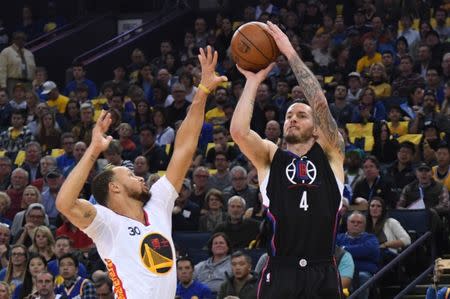 January 28, 2017; Oakland, CA, USA; Los Angeles Clippers guard J.J. Redick (4) shoots the basketball against Golden State Warriors guard Stephen Curry (30) during the first quarter at Oracle Arena. Mandatory Credit: Kyle Terada-USA TODAY Sports