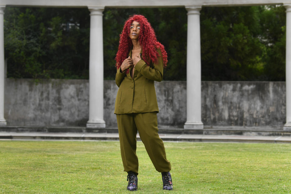 This Aug. 19, 2019 photo shows music artist Buku Abi, born Joann Kelly, posing in Atlanta. As the daughter of R. Kelly, she experienced her fair share of hardships. She is no longer in touch with him and says being R. Kelly’s daughter is like “a double-edged sword.” In March, Abi released her debut EP “Don’t Call Me” and she appeared on the WEtv reality series, “Growing Up Hip Hop: Atlanta.” (AP Photo/John Amis)