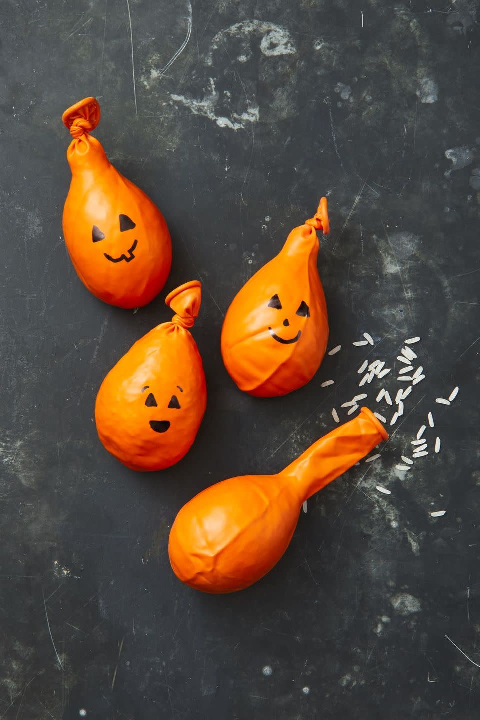 <p>All you need to crate these adorable stress balls (or cornhole bags) is some rice, orange balloons, and a marker. Simply fill the balloons with rice and draw on an adorable face. </p>