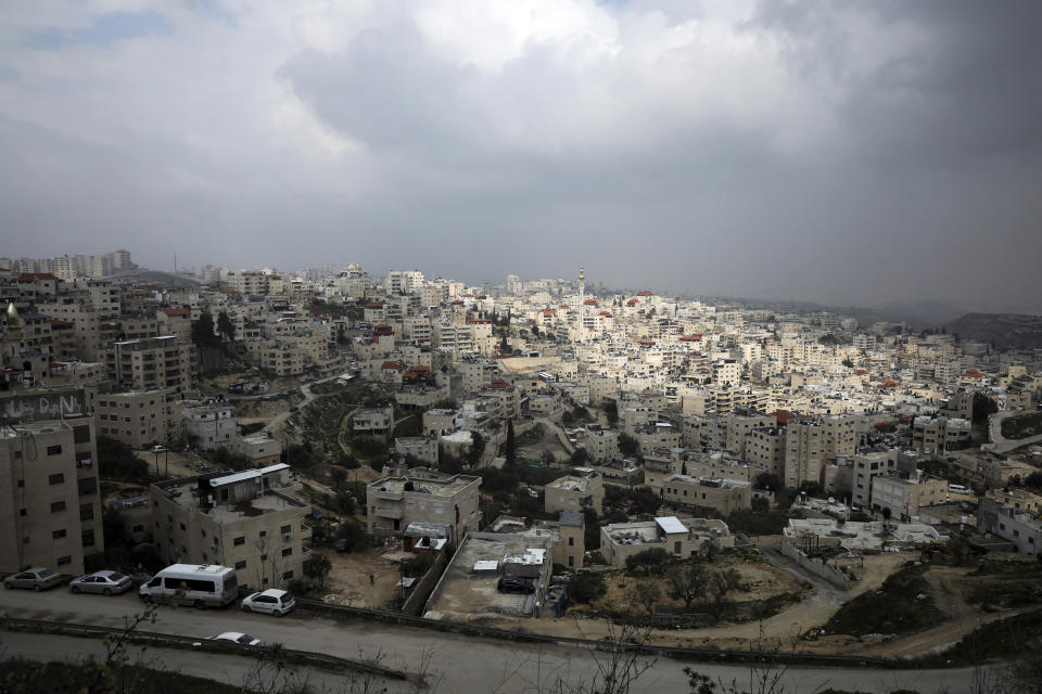 This Monday, Feb. 24 2020 photo, shows a general view of the Palestinian neighborhood of Issawiya in East Jerusalem. Nearly every day for the last nine months Israeli police have stormed into Issawiya in a campaign they say is needed to maintain law and order. Rights groups say that in addition to searching houses and issuing fines, they have detained hundreds of people — some as young as 10, on suspicion of stone-throwing. The operations frequently ignite clashes, with local youths throwing rocks and firebombs, which police say justifies their heightened presence. Residents and human rights groups say the provocative raids have created an atmosphere of terror, with parents afraid to let their children play outside. (AP Photo/Mahmoud Illean)