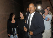 <p>O.J. Simpson, center, and his sister Carmelita Durio arrive for the verdict at the Clark County Regional Justice Center in Las Vegas on Friday, Oct. 3, 2008. Simpson faces 12 charges, including felony kidnapping, armed robbery and conspiracy. The verdict come thirteen years to the day after he was acquitted of double murder charges. (Photo: Jae C. Hong, Pool/AP) </p>