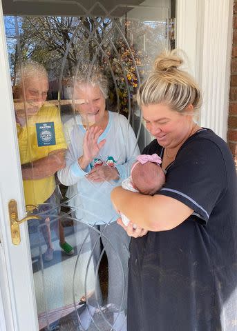 <p>Megan Clark</p> Megan Clark showing Albert "Buddy" Brister and Brenda Brister her daughter Kate after she was born in 2022