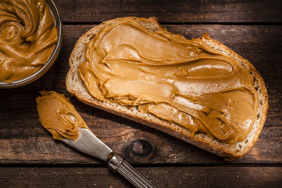 A piece of toast with peanut butter on it