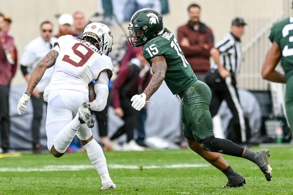 Michigan State's Angelo Grose, right, closes in to tackle Minnesota's Daniel Jackson during the third quarter on Saturday, Sept. 24, 2022, at Spartan Stadium in East Lansing.