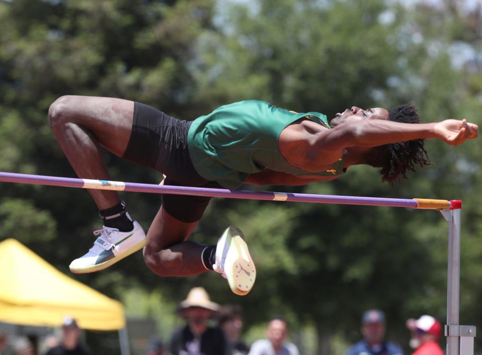 Moorpark's Victor Ezike soars over the bar in the Division 3 boys high jump competition during the CIF-Southern Section Track and Field Championships at Moorpark High on Saturday, May 13, 2023. Ezike finished third in the event and was also fourth in the long jump and fifth in the triple jump.