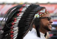 Oct 25, 2016; Cleveland, OH, USA; Cleveland Indians fan Darryl Willis wears a head dress before game one of the 2016 World Series against the Chicago Cubs at Progressive Field. Mandatory Credit: Ken Blaze-USA TODAY Sports