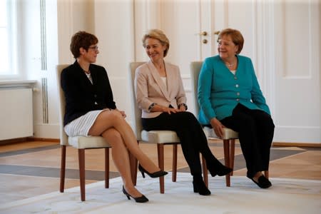 German defence Minister Ursula von der Leyen, incoming defence Minister Annegret Kramp-Karrenbauer and Chancellor Angela Merkel attend a ceremony at Bellevue Palace in Berlin