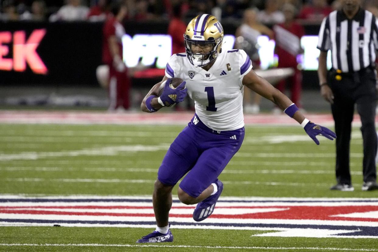 Washington wide receiver Rome Odunze runs after a catch against Arizona.