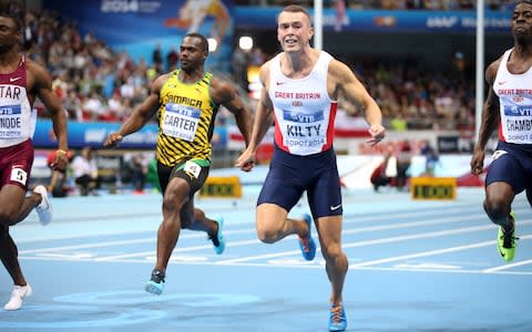 Kilty beat Chambers to win the world 60m title in 2014 - Credit: GETTY IMAGES
