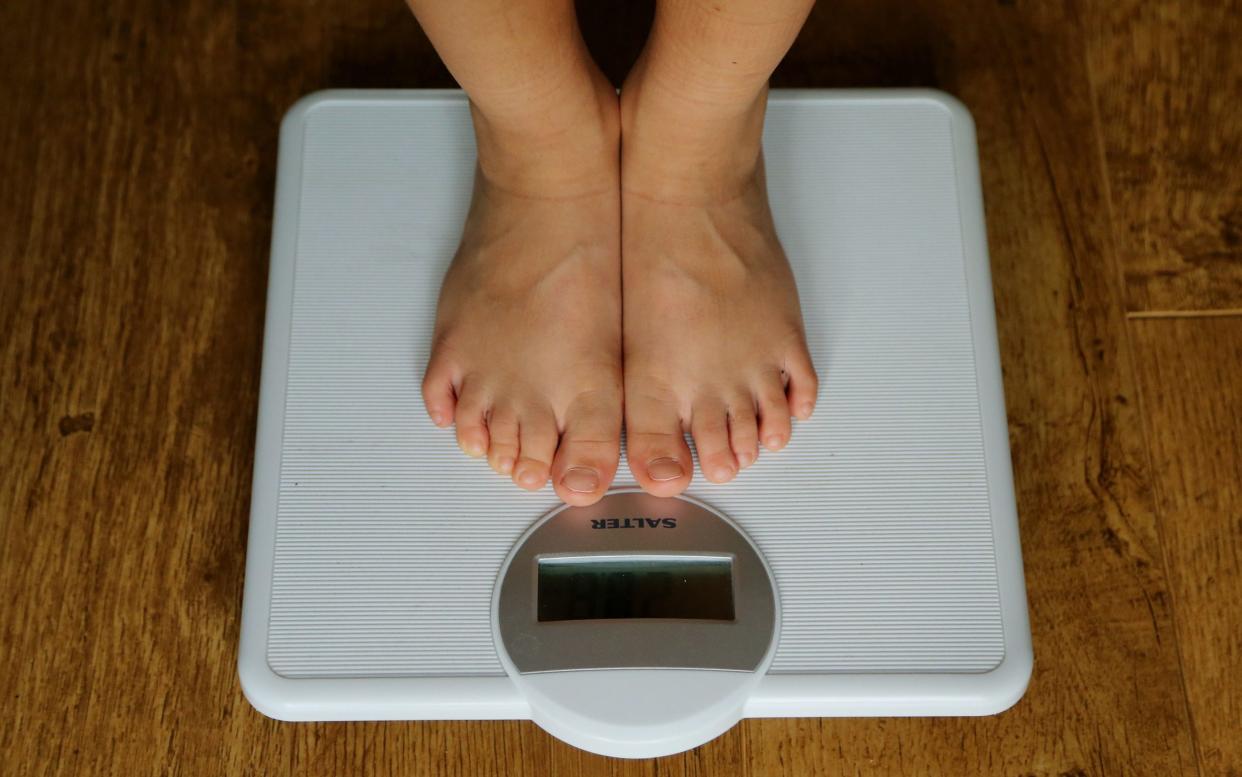 Child on scales - Gareth Fuller/PA
