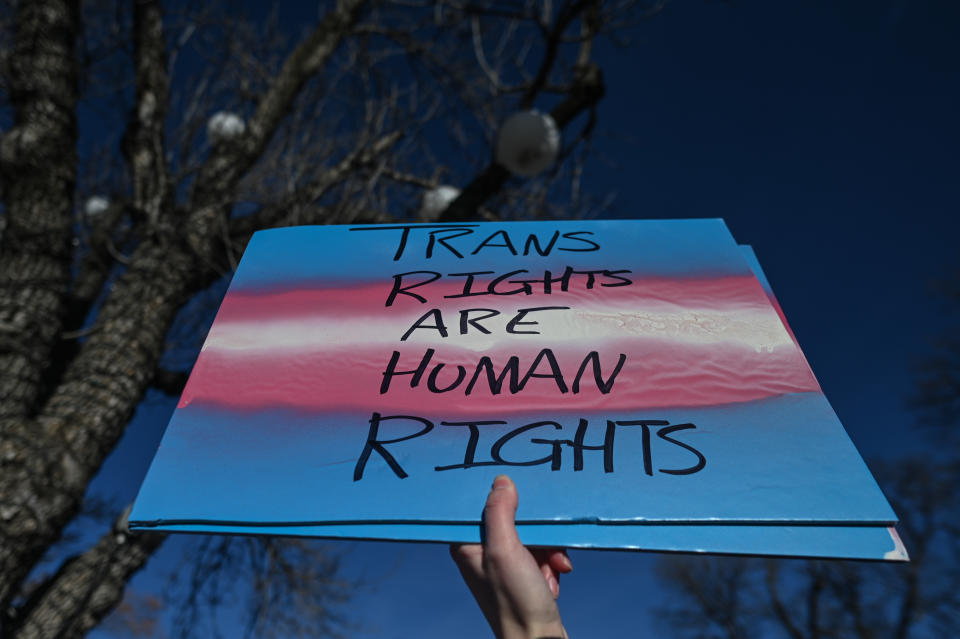 Protests were held across Alberta after Premier Smith's proposed changes to policies that could impact transgender minors. (Image via Getty Images)