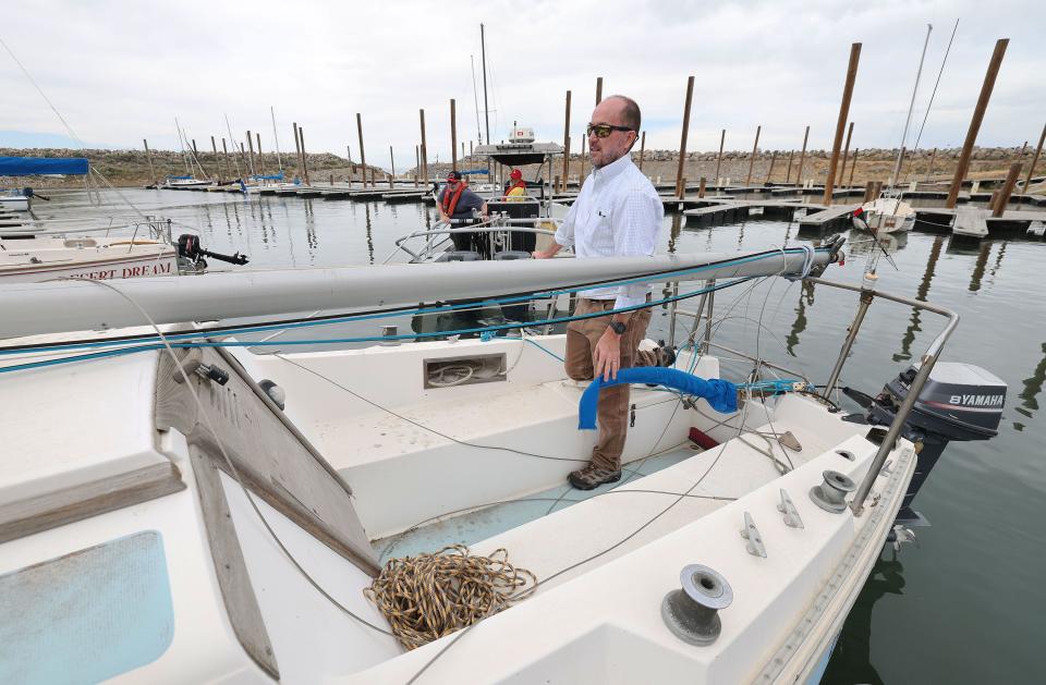 Jimmy Ludlow prepares to have his sailboat towed to his slip after it was hoisted into the Great Salt Lake marina in Salt Lake City on Tuesday, June 6, 2023. Water levels have risen enough for sailing on the lake. | Jeffrey D. Allred, Deseret News