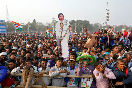 A supporter holds a cut-out of Mamata Banerjee, Chief Minister of the state of West Bengal, during "United India" rally attended by the leaders of India's main opposition parties ahead of the general election, in Kolkata, India, January 19, 2019. REUTERS/Rupak De Chowdhuri