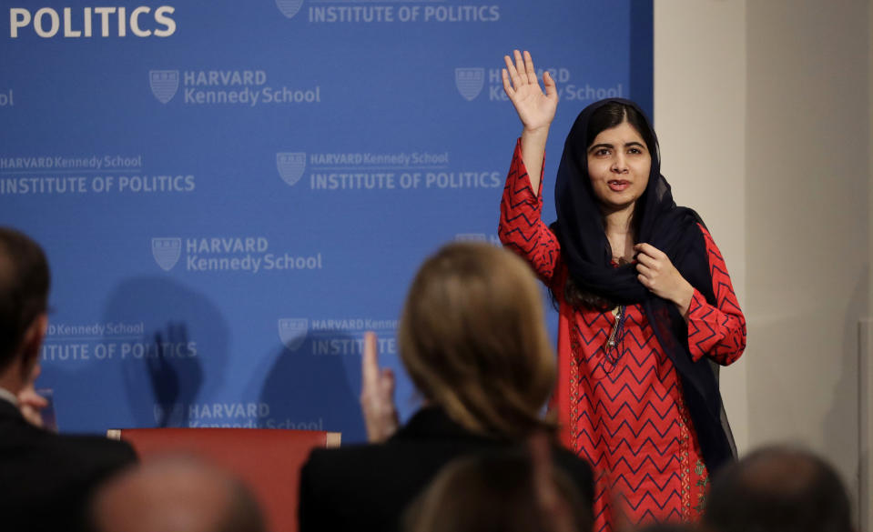 2014 Nobel Laureate Malala Yousafzai waves as she is introduced prior to addressing a gathering at the Kennedy School's Institute of Politics at Harvard University, Thursday, Dec. 6, 2018. (AP Photo/Charles Krupa)