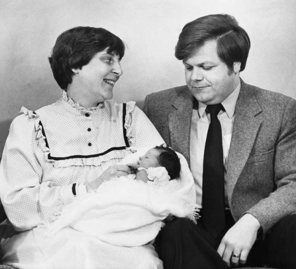 In an old photo, Judith Carr of Westminster, Massachusetts, holds her newborn daughter, Elizabeth. 