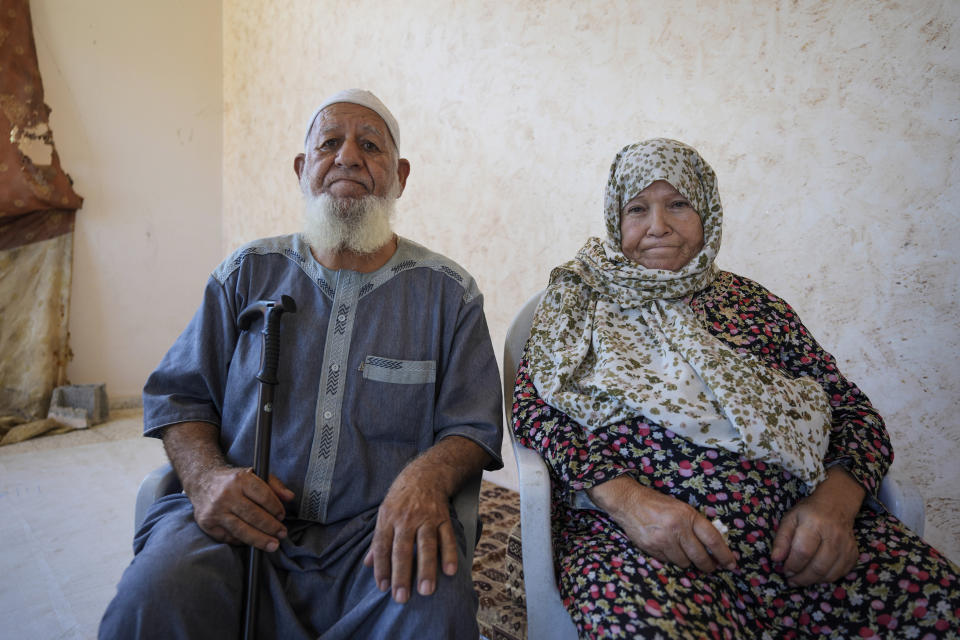 Abdel Haleem Abu Mutlaq, and his wife Amna Abu Mutlaq, pose for a portrait in Khan Younis, Gaza Strip, Wednesday, June 12, 2024. "We are deprived of (performing) Hajj because the crossing is closed, and because of the raging wars and destruction," said Amna Abu Mutlaq, a 75-year-old Palestinian woman from Gaza's southern city of Khan Younis who had planned to perform the Hajj pilgrimage this year. (AP Photo/Abdel Kareem Hana)