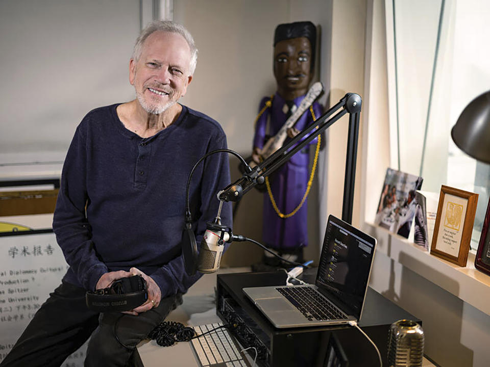 This image provided by Tulane University shows Nick Spitzer, host of the weekly public radio music and cultural program, American Routes, in his studio at Tulane University in New Orleans on Monday, Jan. 30, 2023. The show is celebrating “25 Years on the Road” in September, and Spitzer is being honored at the Library of Congress in Washington, D.C., on Sept. 29. (Rusty Costanza/Tulane University via AP)
