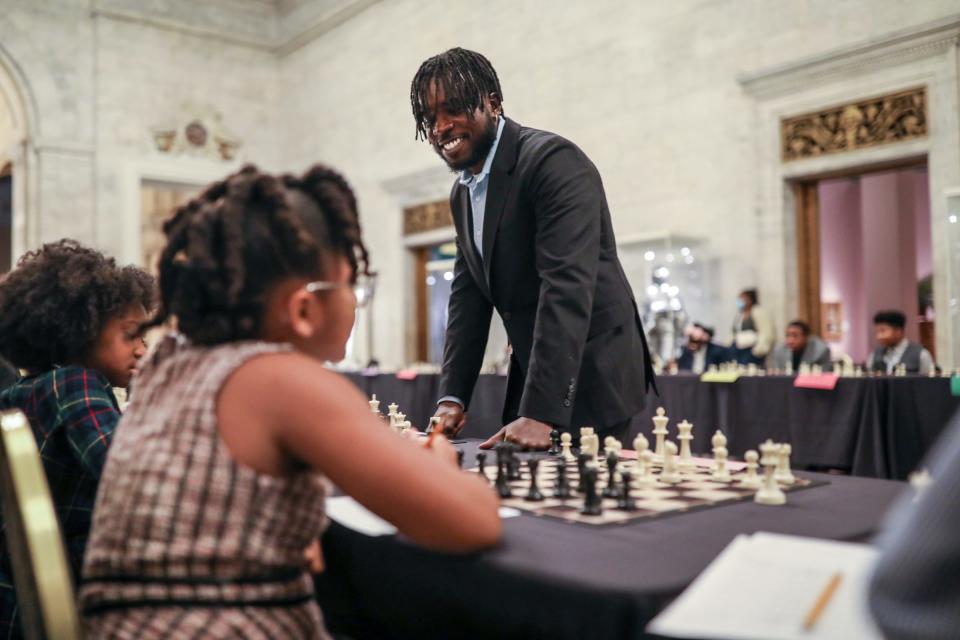 International Master Justus Williams plays chess simultaneously against selected members of the Detroit City Chess Club in the Great Hall at the Detroit Institute of Arts in Detroit on Friday, Dec. 8, 2023.