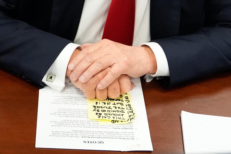 Former US President and Republican presidential candidate Donald Trump  sits in court during his trial for allegedly covering up hush money payments at Manhattan Criminal Court (POOL/AFP via Getty Images)