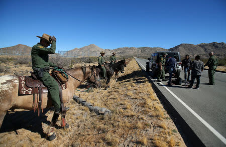 U.S. Border Patrol agents from Boulevard Station inspect three men near Jacumba, California, U.S., November 14, 2016. REUTERS/Mike Blake