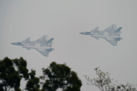J-20 stealth fighters of Chinese People's Liberation Army Air Force (PLAAF) are seen during a test flight ahead of the China International Aviation and Aerospace Exhibition, or Zhuhai Airshow in Zhuhai, Guangdong province, China November 3, 2018. REUTERS/Stringer