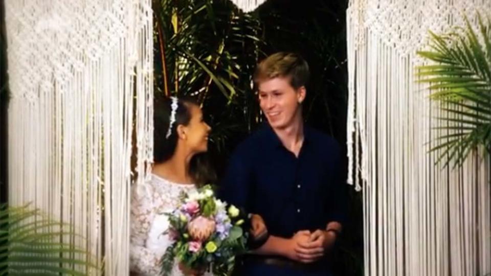 Robert Irwin walks Bindi Irwin down the aisle during wedding to Chandler Powell