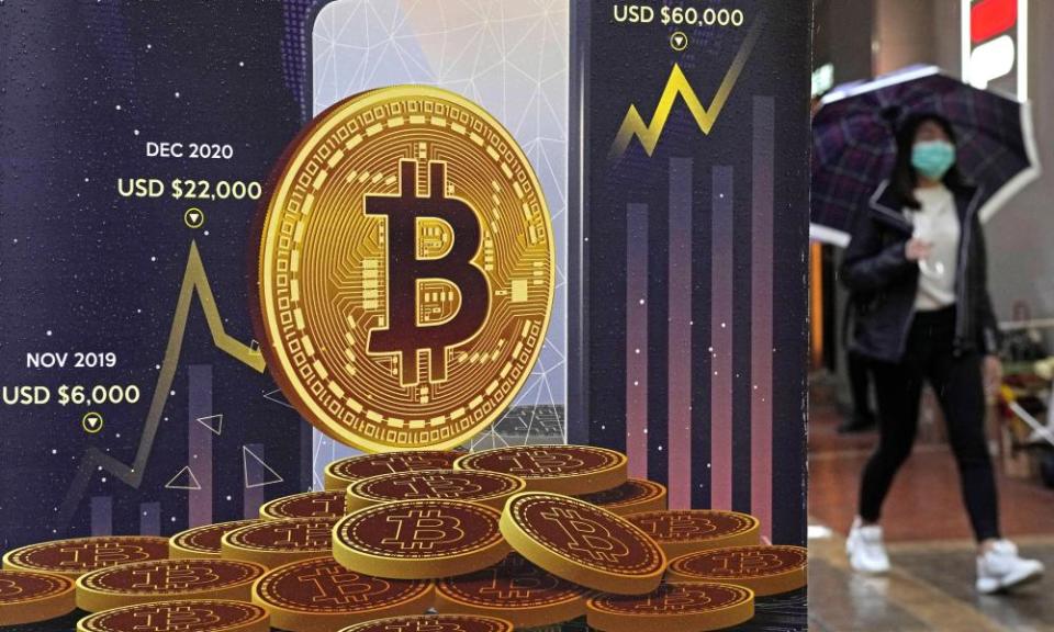 An ad for Bitcoin cryptocurrency is displayed on a street in Hong Kong