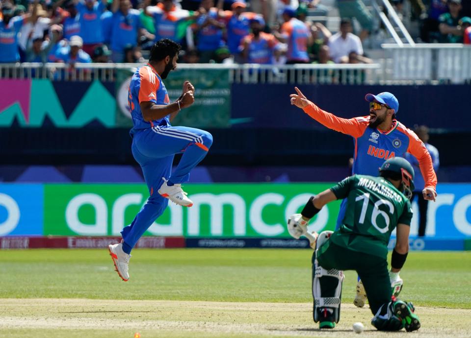 India's Jasprit Bumrah (L) celebrates after dismissing Pakistan's Mohammad Rizwan during the Twenty20 World Cup 2024 match between India and Pakistan at Nassau County International Cricket Stadium in East Meadow, New York on June 9, 2024.