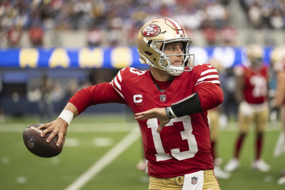 San Francisco 49ers quarterback Brock Purdy (13) throws against the Rams.