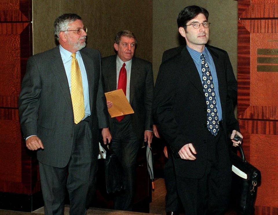 FILE - In this Oct. 13, 1998, file photo, from left, NBA Commissioner David Stern, Phoenix Suns owner Jerry Colangelo, and chief legal counsel Jeffrey Pollack, leave a meeting between owners and players in New York during the lockout. He is not in the Hall of Fame, he never played in an All-Star game and he is about a foot shorter than most NBA stars. But try to find an NBA legacy more lasting than Stern's, who is retiring Saturday, Feb. 1, 2014 after exactly 30 years on the job. (AP Photo/Ed Bailey, File)