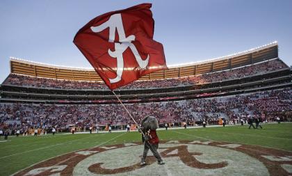 Alabama mascot Big Al waves an Alabama flag following a 45-10 win over Tennessee in an NCAA college football game in Tuscaloosa, Ala., Saturday, Oct. 26, 2013. (AP Photo/Dave Martin)