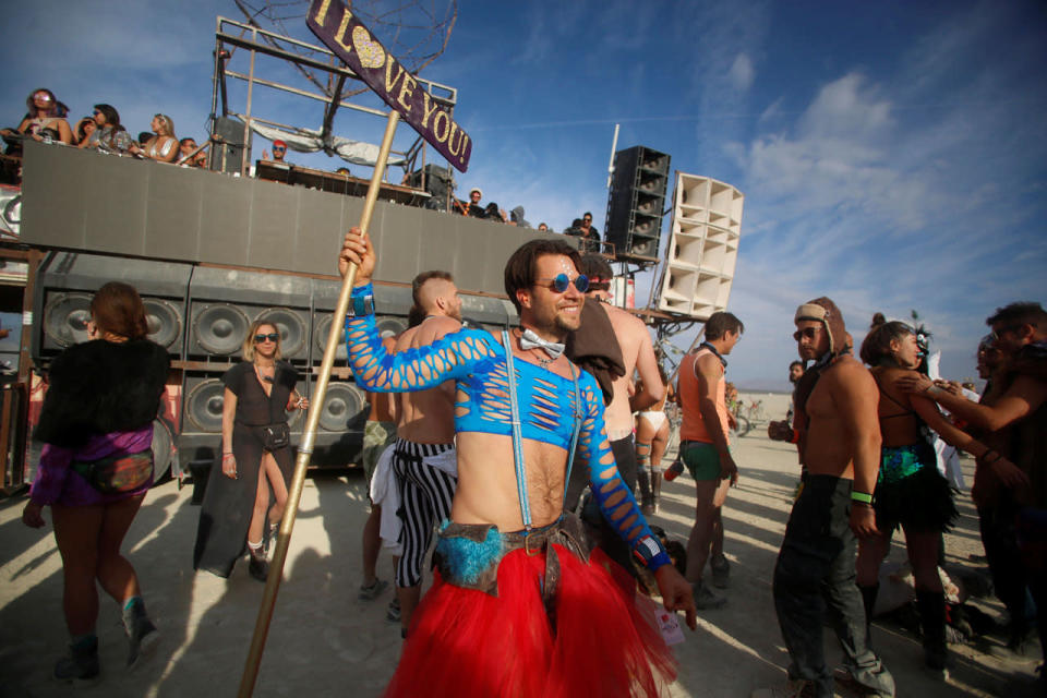 <p>A participant dances as approximately 70,000 people from all over the world gather for the 30th annual Burning Man arts and music festival in the Black Rock Desert of Nevada, Aug. 30, 2016. (REUTERS/Jim Urquhart)</p>