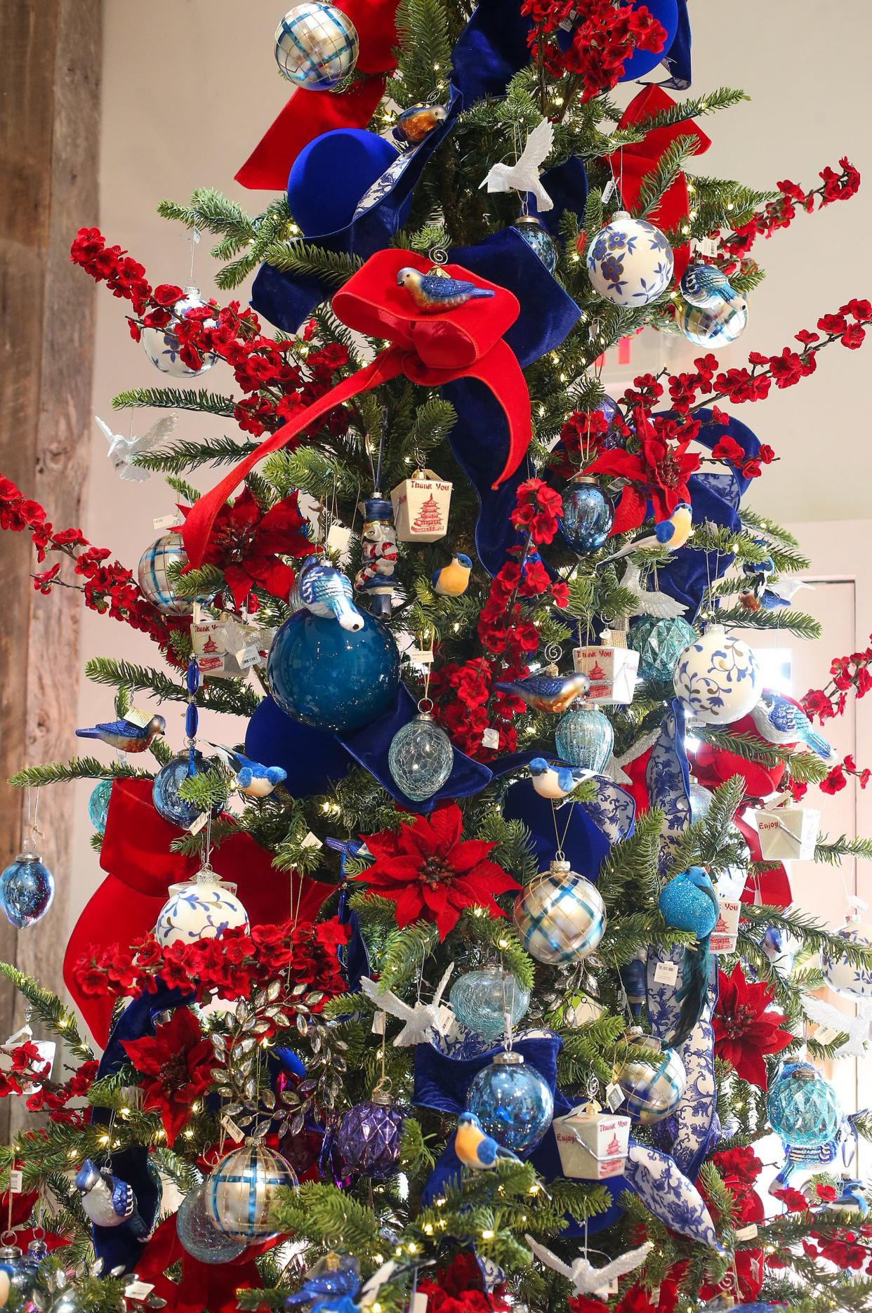 A blue and red tree at Digs Home and Garden in St. Matthews