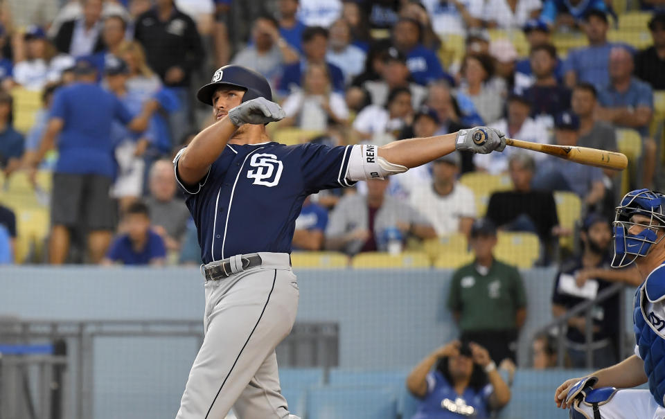 San Diego Padres' Hunter Renfroe watches his solo home run next to Los Angeles Dodgers catcher Will Smith during the second inning of a baseball game Thursday, Aug. 1, 2019, in Los Angeles. (AP Photo/Mark J. Terrill)