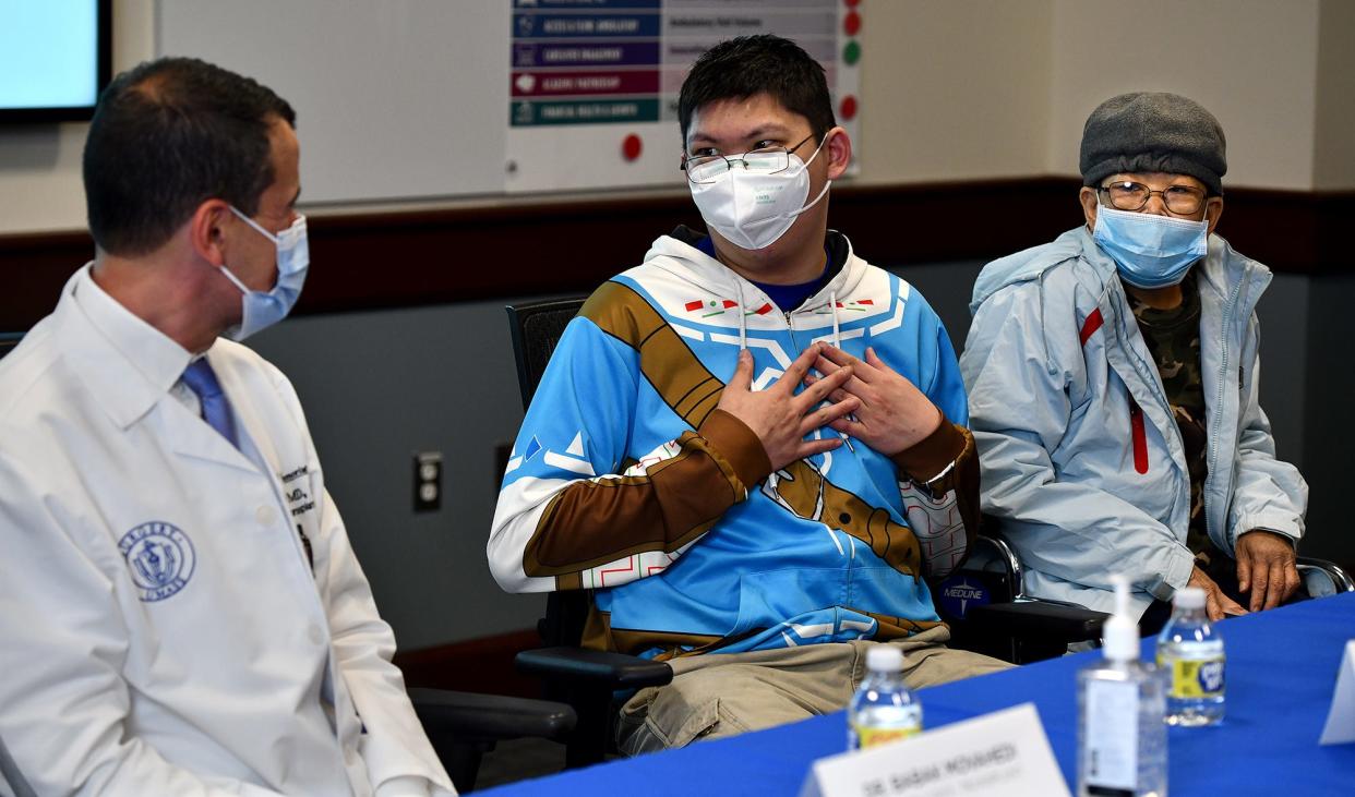 UMass Memorial Medical Center patients Kai Chen, center, and his mother, Kam Look, of Amherst, thank their UMass Memorial Health care team, including Dr. Babek Movahedi, left, after Chen and Look both suffered from severe, life-threatening liver damage after consuming poisonous mushrooms.