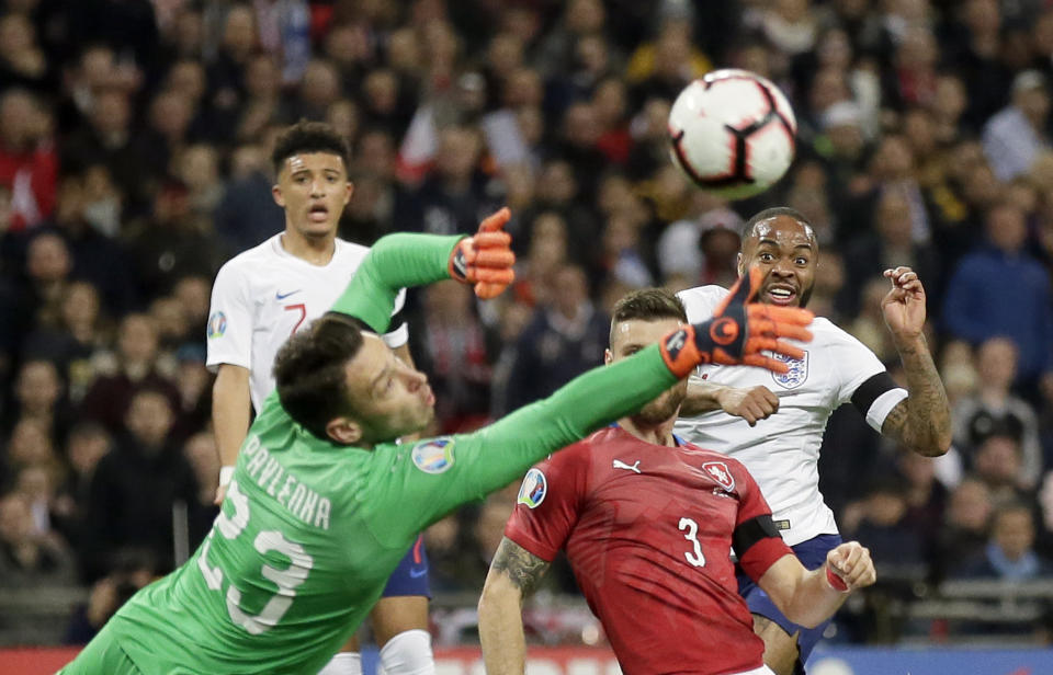 England's Raheem Sterling, right, scores his side's third goal during the Euro 2020 group A qualifying soccer match between England and the Czech Republic at Wembley stadium in London, Friday March 22, 2019. (AP Photo/Tim Ireland)