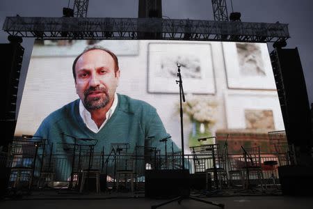 Director Asghar Farhadi speak via a video link at the screening of the film The Salesman in Trafalgar Square in London, Britain February 26, 2017. REUTERS/Neil Hall