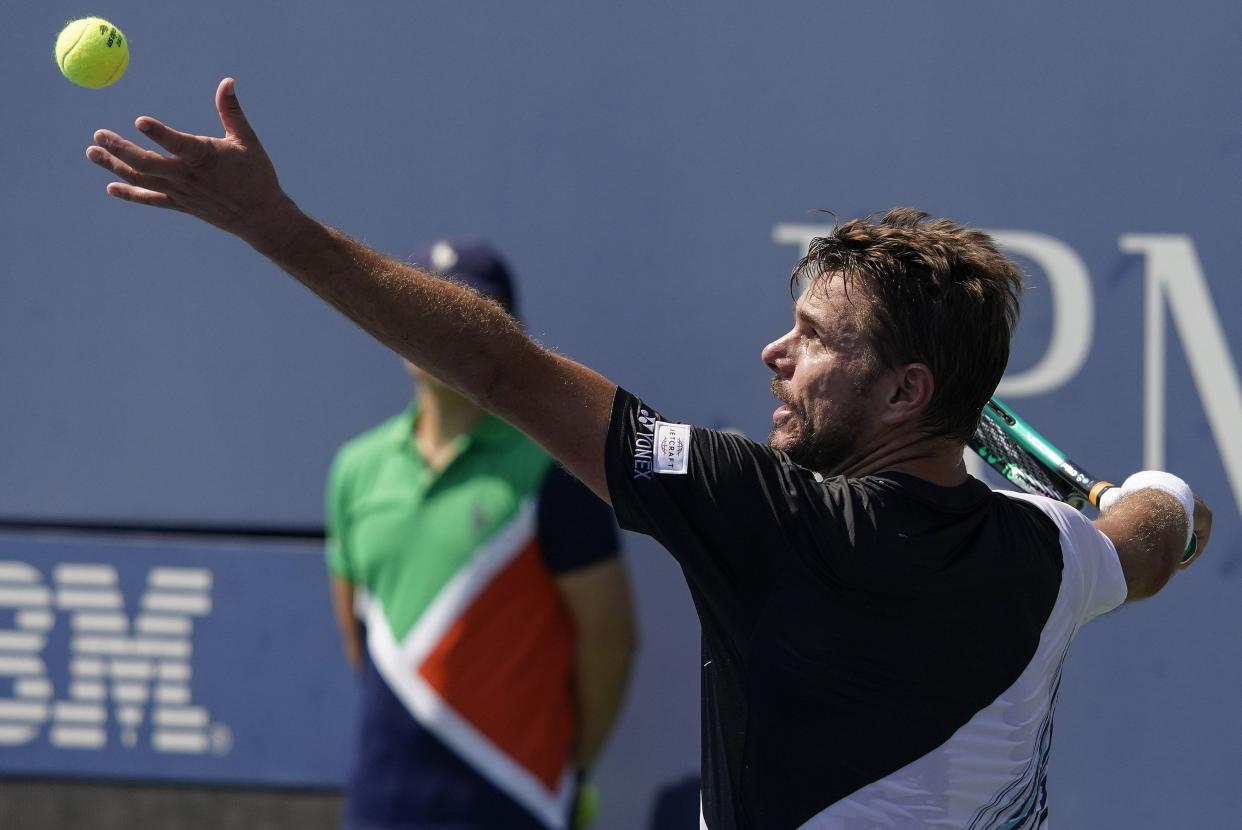 Stan Wawrinka, of Switzerland, serves to Corentin Moutet, of France, during the first round of the U.S. Open tennis championships, Monday, Aug. 29, 2022, in New York.