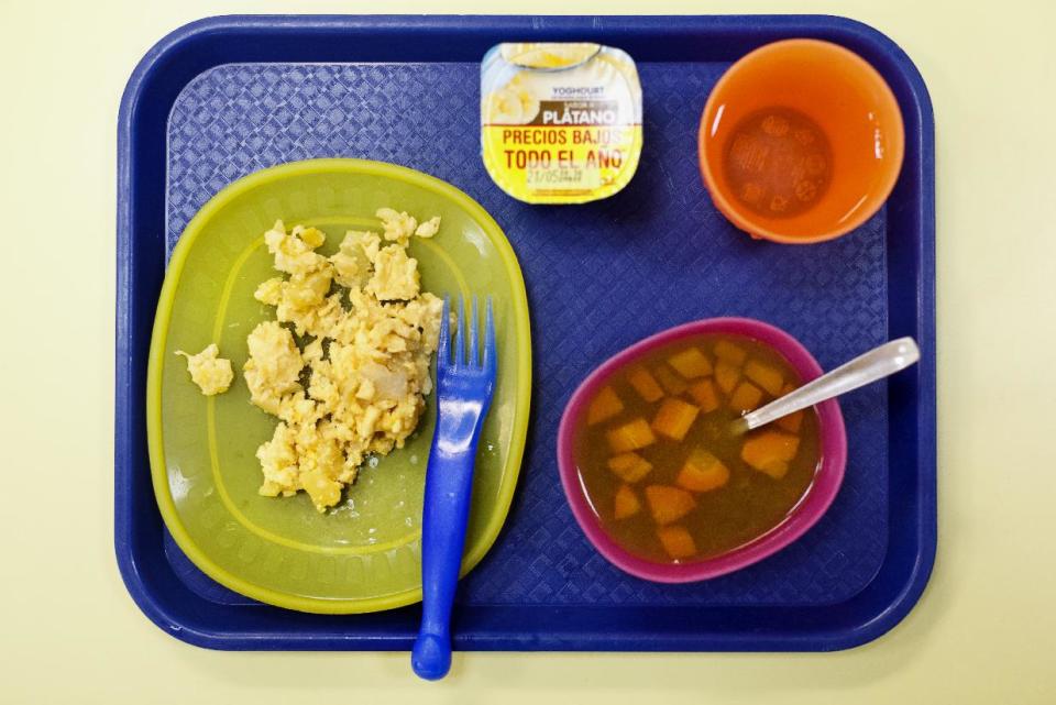 The a school lunch of an omelette, vegetable soup, banana yogurt and water are served at the Chiquitin kindergarten in Madrid, Spain, Tuesday, May 6, 2014. Most countries seem to put a premium on feeding school children a healthy meal at lunchtime. U.S. first lady Michelle Obama is on a mission to make American school lunches healthier too. (AP Photo/Daniel Ochoa de Olza)