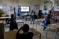 FILE PHOTO: Children return to the school as the coronavirus disease (COVID-19) lockdown eases in Fulham, West London