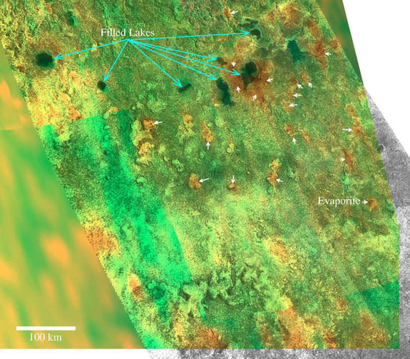 Cassini VIMS/RADAR hybrid image of filled and dry lakes south of Titan's methane sea Ligeia Mare. Blue arrows indicate current lakes, while the white arrows point to evaporates on dry lakes.